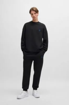 Cotton-terry tracksuit bottoms with Happy HUGO logo patch