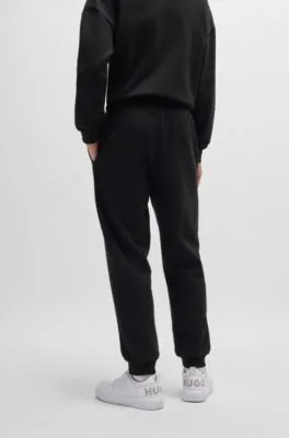 Cotton-terry tracksuit bottoms with Happy HUGO logo patch