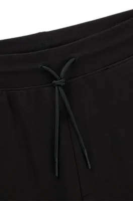 Cotton-terry tracksuit bottoms with Happy HUGO logo patch