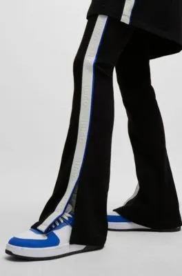 Flared tracksuit bottoms in stretch cotton with logo tape