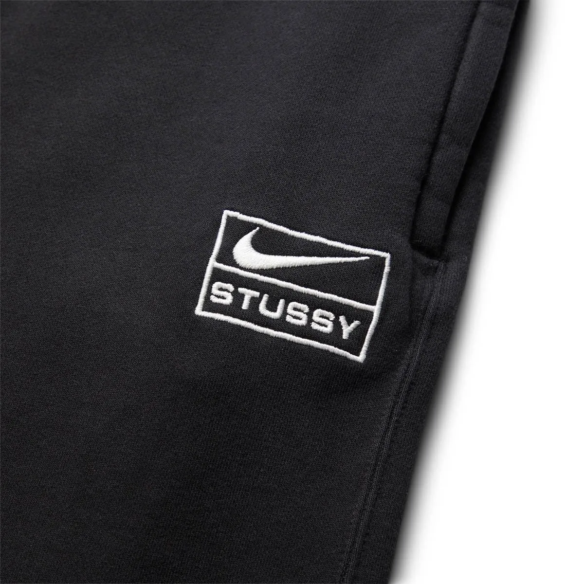 X STUSSY STONEWASHED BLACK TRACKSUIT BOTTOMS [DN4030-010] | Bodega